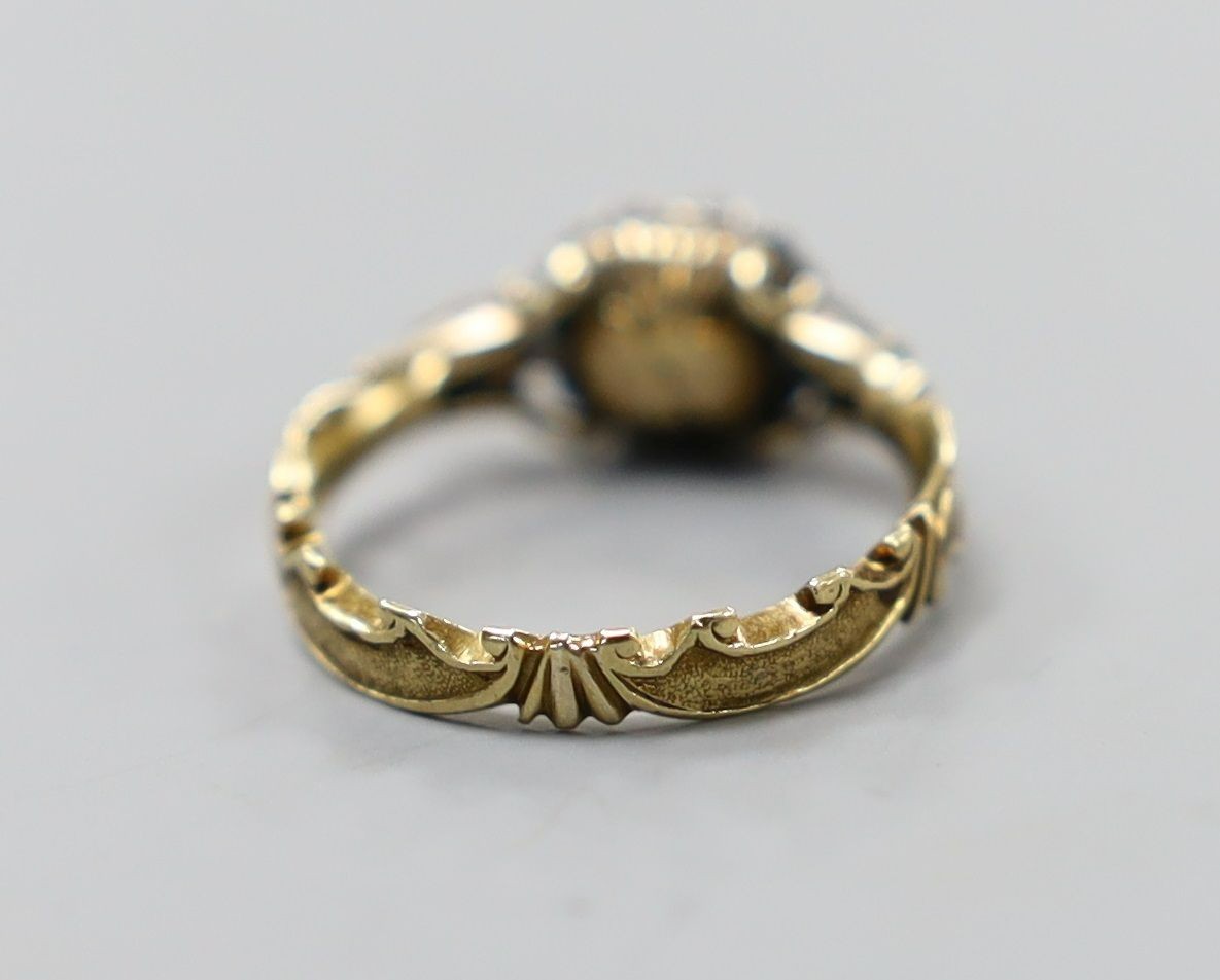 A late 18th century gold and old cut diamond set circular cluster ring